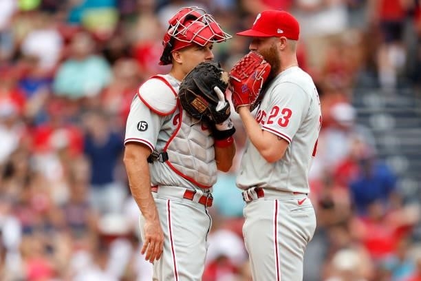 Realmuto of the Philadelphia Phillies talks with Archie Bradley during the sixth inning against the Boston Red Sox at Fenway Park on July 11, 2021 in...