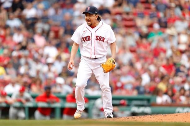 Hirokazu Sawamura of the Boston Red Sox celebrates after striking out J.T. Realmuto of the Philadelphia Phillies during the seventh inning at Fenway...