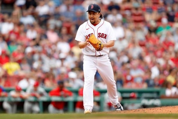 Hirokazu Sawamura of the Boston Red Sox celebrates after striking out J.T. Realmuto of the Philadelphia Phillies during the seventh inning at Fenway...