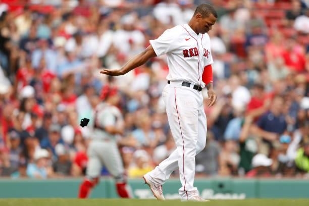 Rafael Devers of the Boston Red Sox reacts after striking out during the seventh inning against the Philadelphia Phillies at Fenway Park on July 11,...