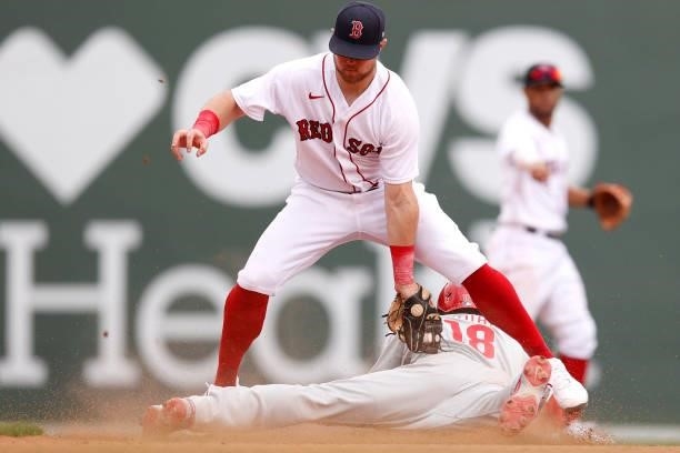 Christian Arroyo of the Boston Red Sox tags out Didi Gregorius of the Philadelphia Phillies at second base during the eighth inning at Fenway Park on...