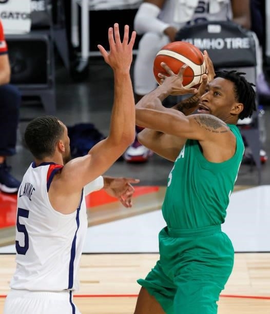 Stanley Okoye of Nigeria shoots against Zach LaVine of the United States during an exhibition game at Michelob ULTRA Arena ahead of the Tokyo Olympic...