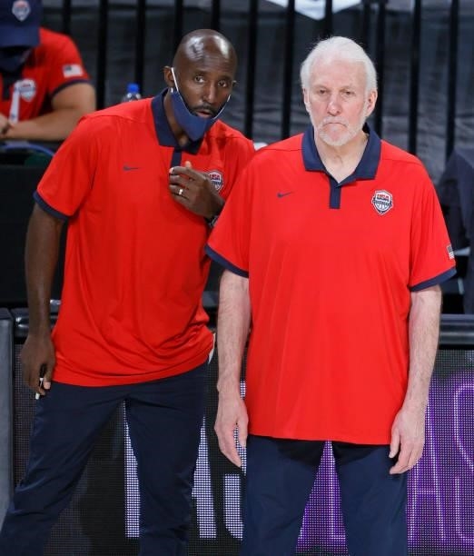 Assistant coach Lloyd Pierce of the United States talks with head coach Gregg Popovich during an exhibition game against Nigeria at Michelob ULTRA...