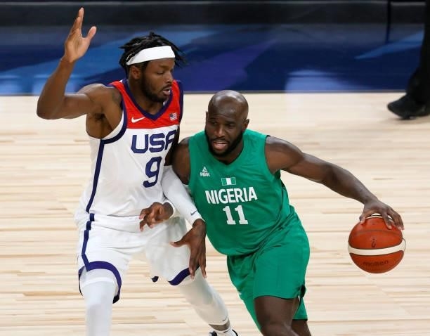Obi Emegano of Nigeria drives against Jerami Grant of the United States during an exhibition game at Michelob ULTRA Arena ahead of the Tokyo Olympic...