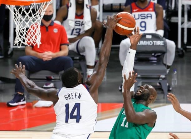 Draymond Green of the United States blocks a shot by Obi Emegano of Nigeria during an exhibition game at Michelob ULTRA Arena ahead of the Tokyo...