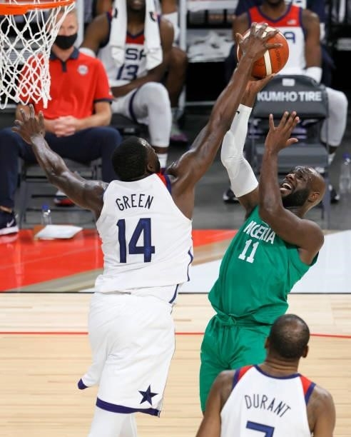 Draymond Green of the United States blocks a shot by Obi Emegano of Nigeria during an exhibition game at Michelob ULTRA Arena ahead of the Tokyo...