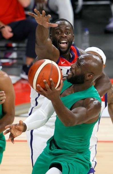 Obi Emegano of Nigeria drives to the basket against Draymond Green of the United States during an exhibition game at Michelob ULTRA Arena ahead of...
