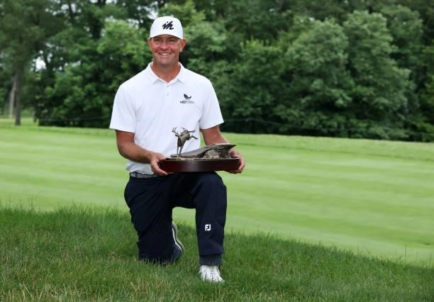 Lucas Glover poses with the trophy after his win in the final round of the John Deere Classic at TPC Deere Run on July 11, 2021 in Silvis, Illinois.