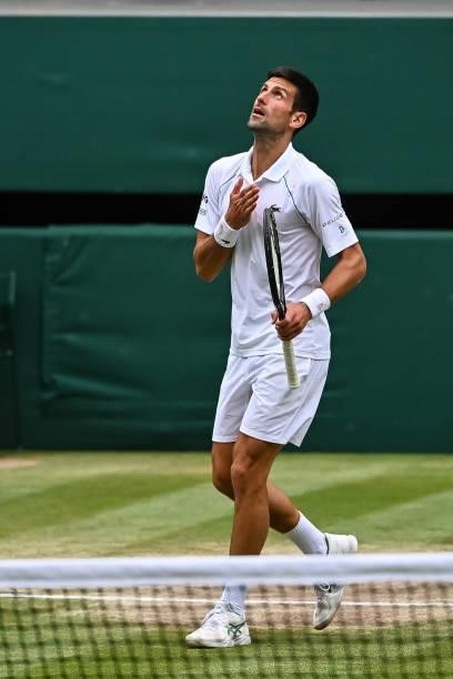 Novak Djokovic of Serbia celebrates beating Mateo Berrettini of Italy in the final of the gentlemen's singles during Day Thirteen of The...
