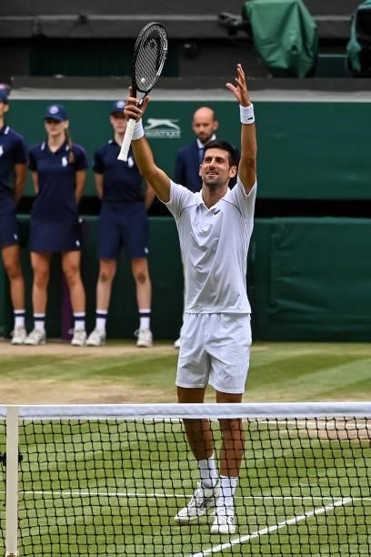 Novak Djokovic of Serbia celebrates beating Mateo Berrettini of Italy in the final of the gentlemen's singles during Day Thirteen of The...