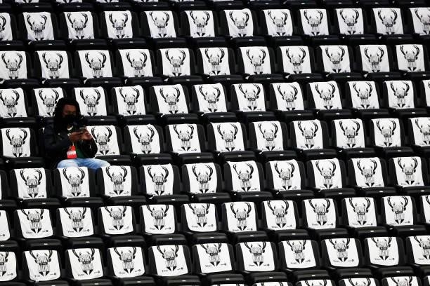 Spectator sits in the stands before the start of Game Three of the NBA Finals at Fiserv Forum between the Milwaukee Bucks vs Phoenix Suns on July 11,...