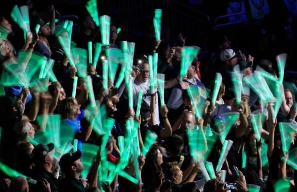 Spectators wave glow sticks in the stands during the first half in Game Three of the NBA Finals between the Milwaukee Bucks and Phoenix Suns at...