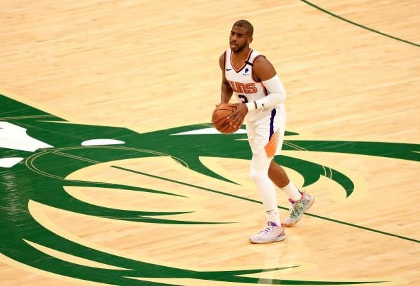 Chris Paul of the Phoenix Suns brings the ball up the court during the first half in Game Three of the NBA Finals against the Milwaukee Bucks at...