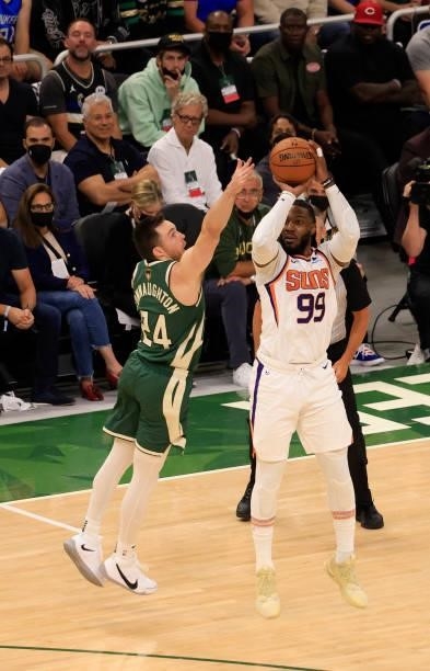 Jae Crowder of the Phoenix Suns takes a jump shot over Pat Connaughton of the Milwaukee Bucks during the first half in Game Three of the NBA Finals...