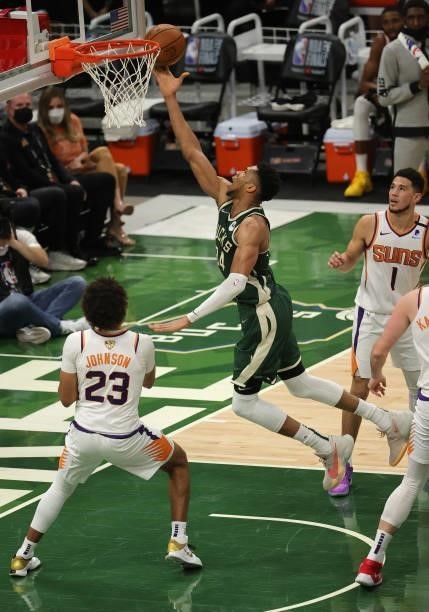 Giannis Antetokounmpo of the Milwaukee Bucks goes up for a layup during the first half in Game Three of the NBA Finals against the Phoenix Suns at...