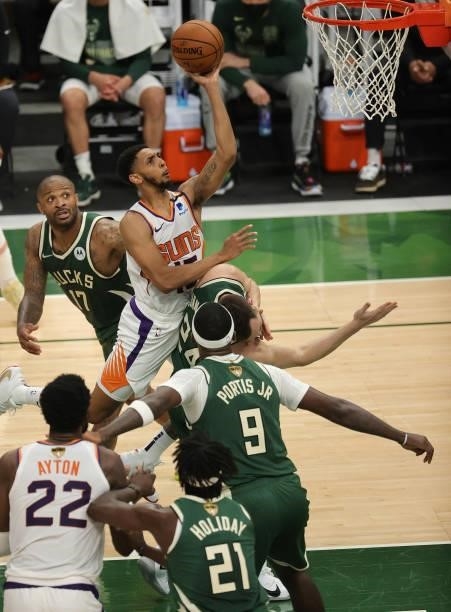 Cameron Payne of the Phoenix Suns drives into the lane for a layup during the first half in Game Three of the NBA Finals against the Milwaukee Bucks...