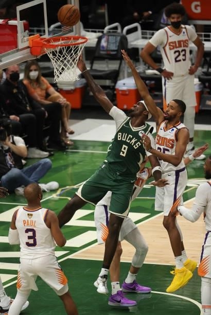 Bobby Portis of the Milwaukee Bucks goes up for a shot against Mikal Bridges of the Phoenix Suns during the first half in Game Three of the NBA...