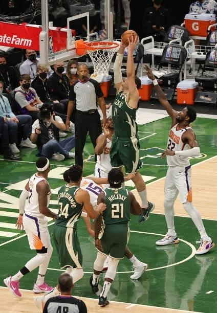 Brook Lopez of the Milwaukee Bucks goes up for a dunk during the first half in Game Three of the NBA Finals against the Phoenix Suns at Fiserv Forum...