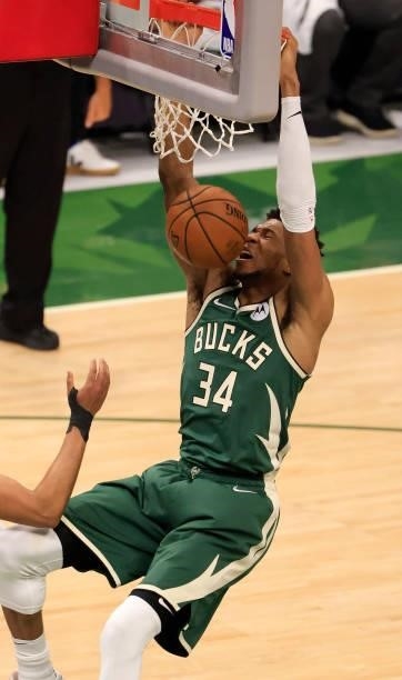 Giannis Antetokounmpo of the Milwaukee Bucks dunks the ball during the second half in Game Three of the NBA Finals against the Phoenix Suns at Fiserv...