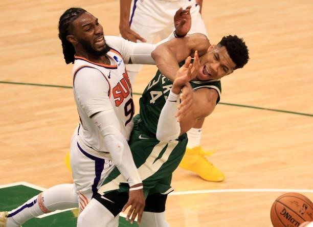 Giannis Antetokounmpo of the Milwaukee Bucks and Jae Crowder of the Phoenix Suns battle for possession of the ball during the second half in Game...