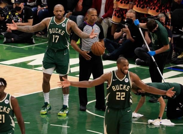 Tucker and Khris Middleton of the Milwaukee Bucks question a call during the second half in Game Three of the NBA Finals against the Phoenix Suns at...