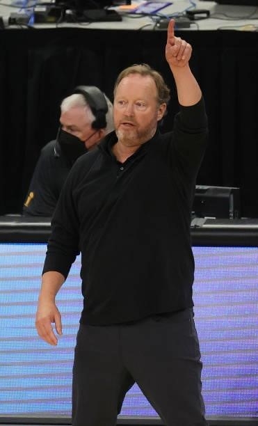 Head coach Mike Budenholzer of the Milwaukee Bucks signals against the Phoenix Suns during the second half in Game Three of the NBA Finals at Fiserv...