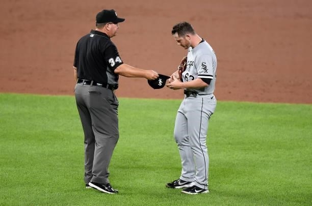 Matt Foster of the Chicago White Sox is checked by umpire Sam Holbrook during the game against the Baltimore Orioles at Oriole Park at Camden Yards...
