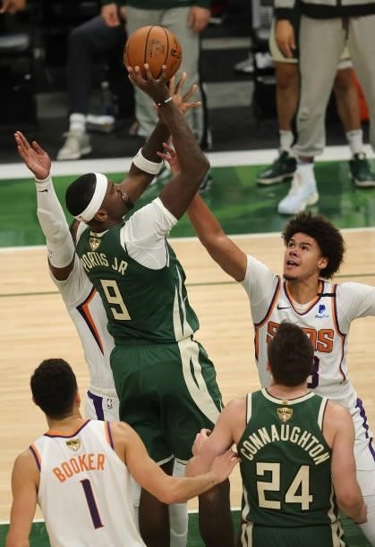 Bobby Portis of the Milwaukee Bucks drives into the lane and shoots over Cameron Johnson of the Phoenix Suns during the second half in Game Three of...