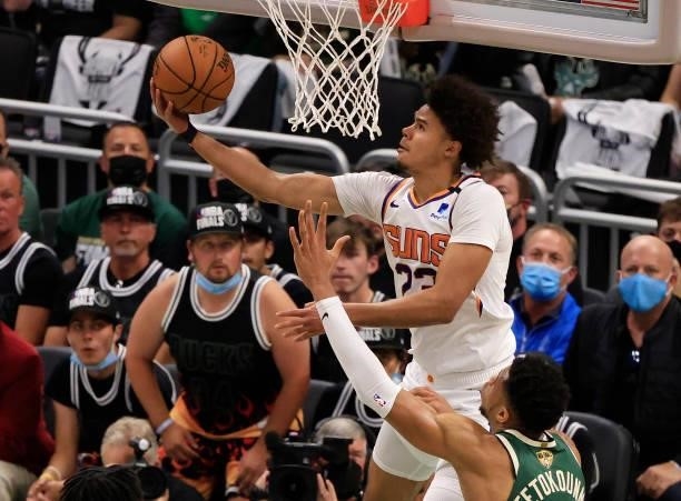 Cameron Johnson of the Phoenix Suns goes up for a reverse layup during the second half in Game Three of the NBA Finals against the Milwaukee Bucks at...