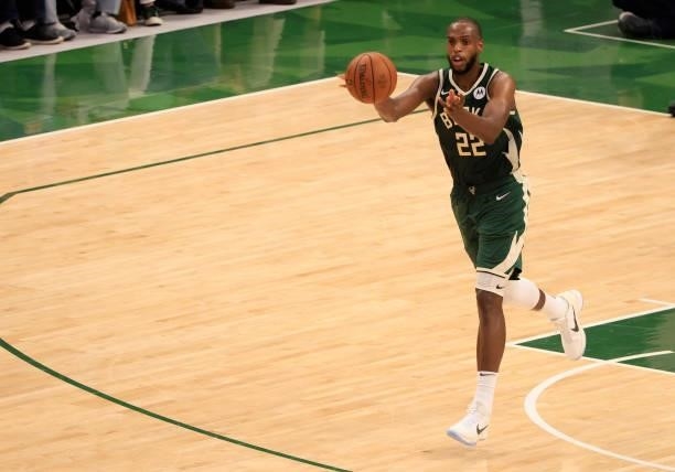 Khris Middleton of the Milwaukee Bucks passes the ball during the second half in Game Three of the NBA Finals against the Phoenix Suns at Fiserv...