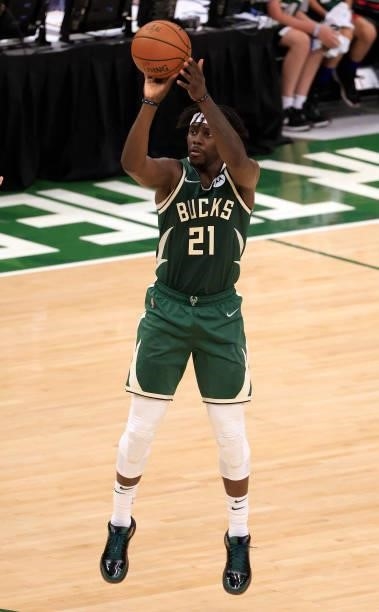 Jrue Holiday of the Milwaukee Bucks takes a jump shot during the second half in Game Three of the NBA Finals at Fiserv Forum on July 11, 2021 in...