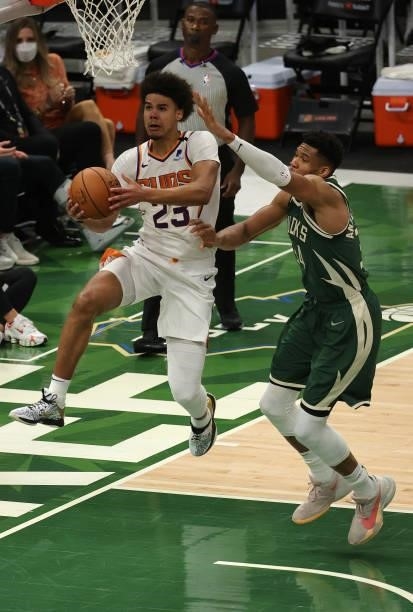 Cameron Johnson of the Phoenix Suns goes up for a shot against Giannis Antetokounmpo of the Milwaukee Bucks during the second half in Game Three of...