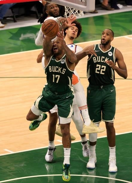 Tucker of the Milwaukee Bucks loses possession of the ball as he drives to the basket during the second half in Game Three of the NBA Finals against...