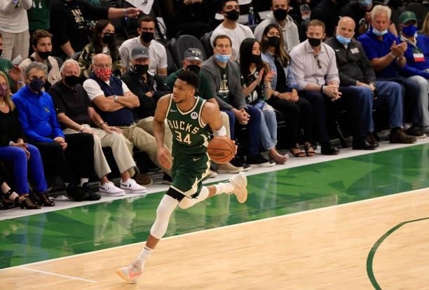Giannis Antetokounmpo of the Milwaukee Bucks brings the ball up the court during the second half in Game Three of the NBA Finals against the Phoenix...