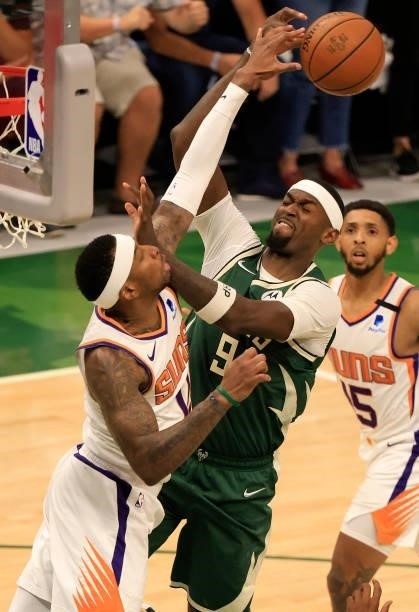 Bobby Portis of the Milwaukee Bucks has his shot blocked by Torrey Craig of the Phoenix Suns during the second half in Game Three of the NBA Finals...