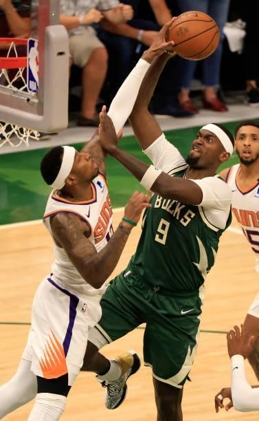 Bobby Portis of the Milwaukee Bucks has his shot blocked by Torrey Craig of the Phoenix Suns during the second half in Game Three of the NBA Finals...