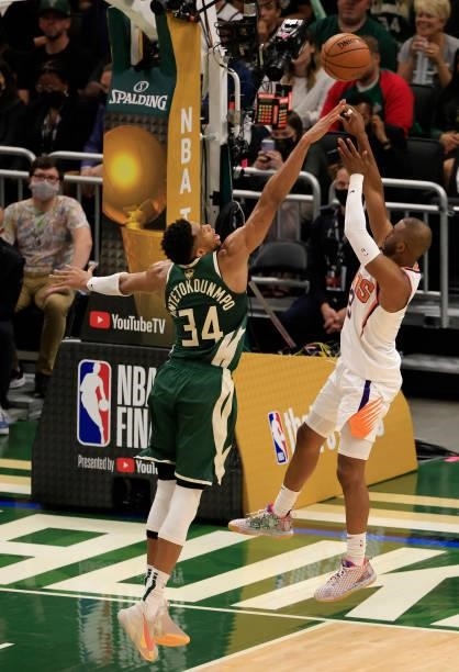 Chris Paul of the Phoenix Suns shoots over Giannis Antetokounmpo of the Milwaukee Bucks during the second half in Game Three of the NBA Finals at...