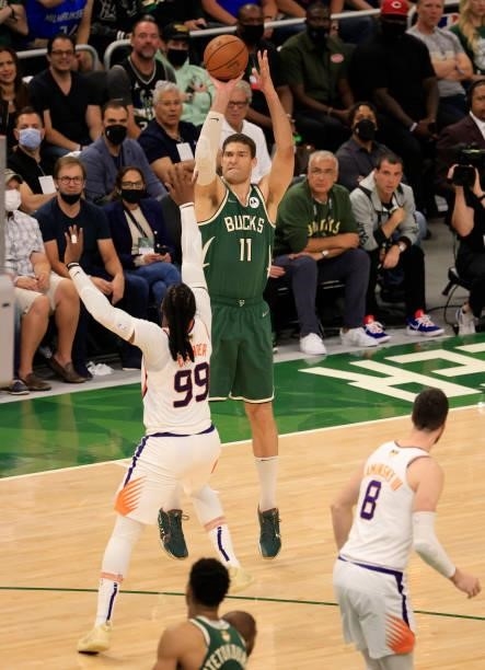 Brook Lopez of the Milwaukee Bucks takes a jump shot over Jae Crowder of the Phoenix Suns during the second half in Game Three of the NBA Finals at...