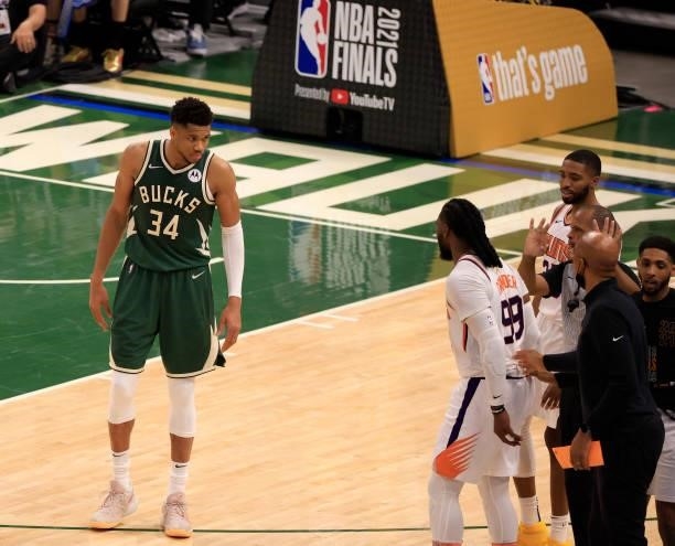 Giannis Antetokounmpo of the Milwaukee Bucks and Jae Crowder of the Phoenix Suns exchange words during the second half in Game Three of the NBA...