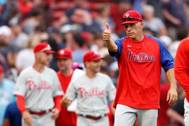 Philadelphia Phillies Manager Joe Girardi waves towards the Boston Red Sox dugout following the Phillies 5-4 win over the Red Sox at Fenway Park on...