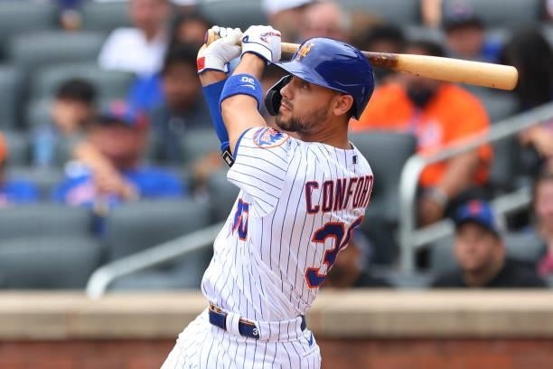 Michael Conforto of the New York Mets hits a three-run home run against the Pittsburgh Pirates during the first inning of a game at Citi Field on...