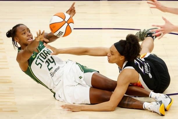 Jewell Loyd of the Seattle Storm passes the ball pressured by Brianna Turner of the Phoenix Mercury during the first half of the WNBA game at Phoenix...