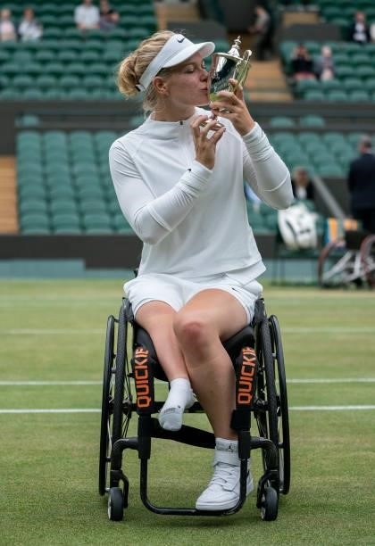 Diede De Groot of Netherlands celebrates with the trophy after winning her Ladies' Wheelchair Singles Final match against Kgothatso Montjane of South...
