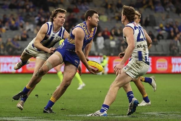 Jeremy McGovern of the Eagles looks to handball during the round 17 AFL match between the West Coast Eagles and North Melbourne Kangaroos at Optus...