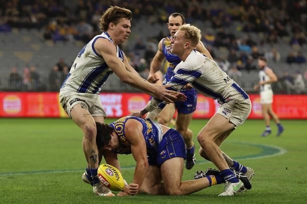 Tom Barrass of the Eagles contests for the ball against Cameron Zurhaar and Jaidyn Stephenson of the Kangaroos during the round 17 AFL match between...