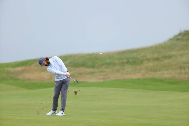 Tommy Fleetwood of England hits his second shot on the 7th hole during a practice round for The 149th Open at Royal St George’s Golf Club on July 12,...