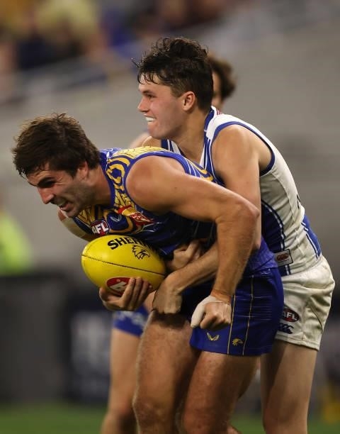 Curtis Taylor of the Kangaroos tackles Andrew Gaff of the Eagles during the round 17 AFL match between the West Coast Eagles and North Melbourne...