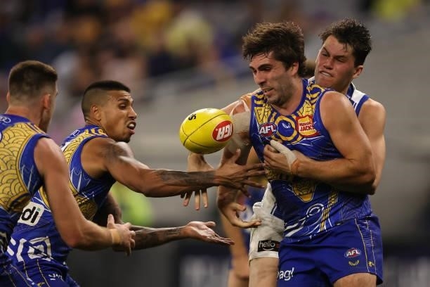 Curtis Taylor of the Kangaroos tackles Andrew Gaff of the Eagles during the round 17 AFL match between the West Coast Eagles and North Melbourne...