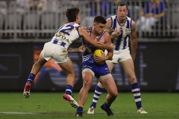 Elliot Yeo of the Eagles gets tackled by Jy Simpkin of the Kangaroos during the round 17 AFL match between the West Coast Eagles and North Melbourne...