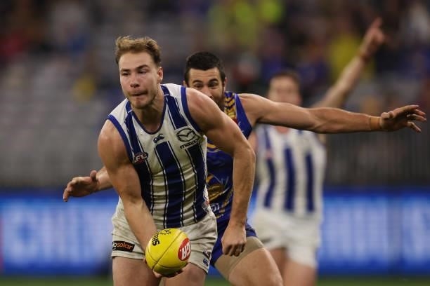 Ben McKay of the Kangaroos handballs during the round 17 AFL match between the West Coast Eagles and North Melbourne Kangaroos at Optus Stadium on...